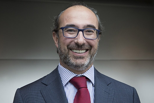 a man smiling for a portrain