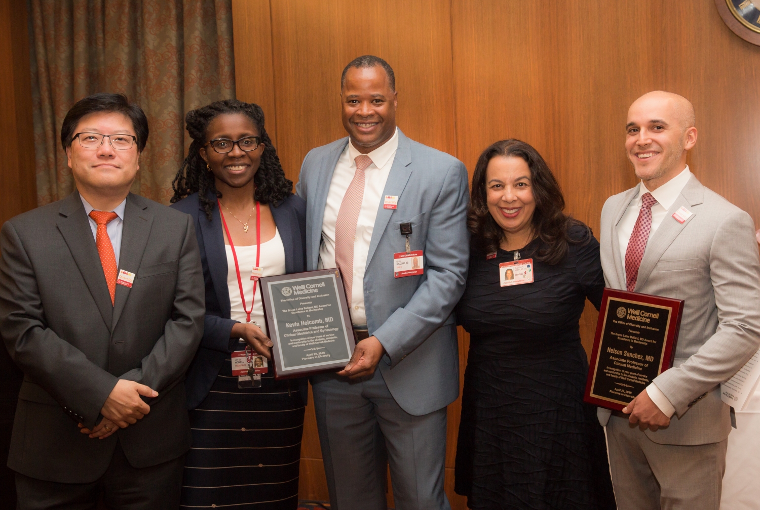 A group of people at an awards ceremony.